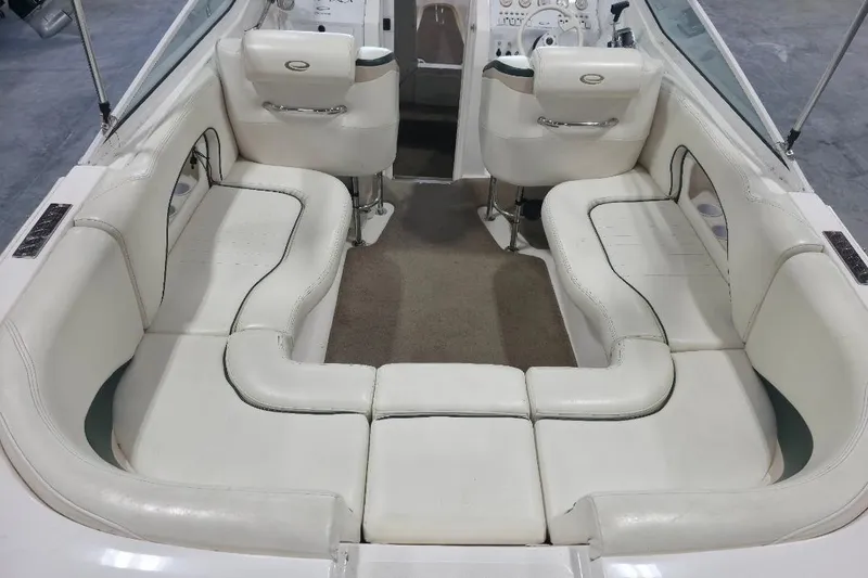 Slide: The Image of Interior of 2005 Envision 2900 Combo boat with white seating and steering console. - 6