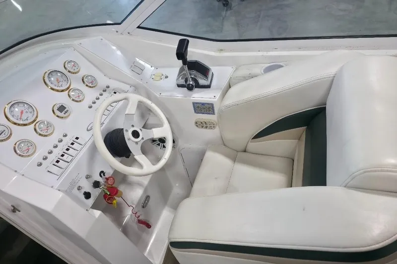 Slide: The Image of Cockpit of 2005 Envision 2900 Combo boat with steering wheel and control panel. - 7