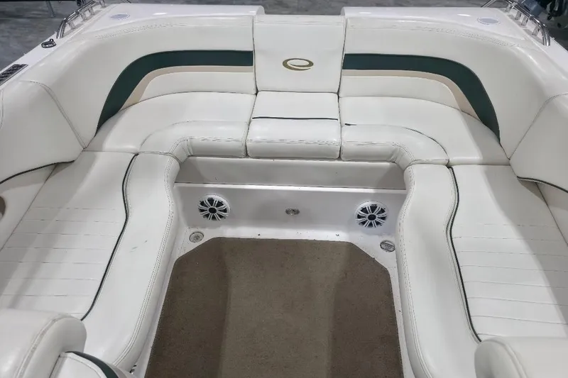 Slide: The Image of Interior seating of a 2005 Envision 2900 Combo boat with white upholstery. - 9