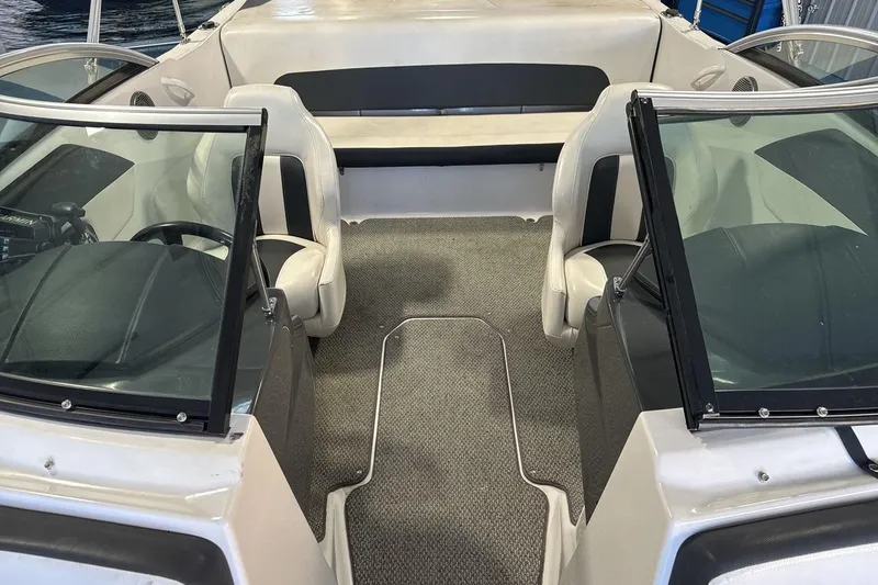 Slide: The Image of 2016 Four Winns 190 Freedom boat interior with seating and windshield. - 12