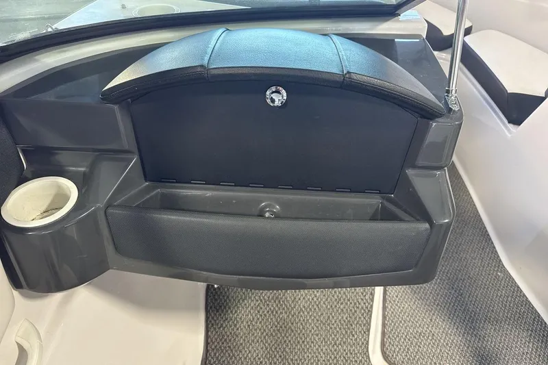 Slide: The Image of Interior of 2016 Four Winns 190 Freedom boat with glove compartment and cup holder. - 18