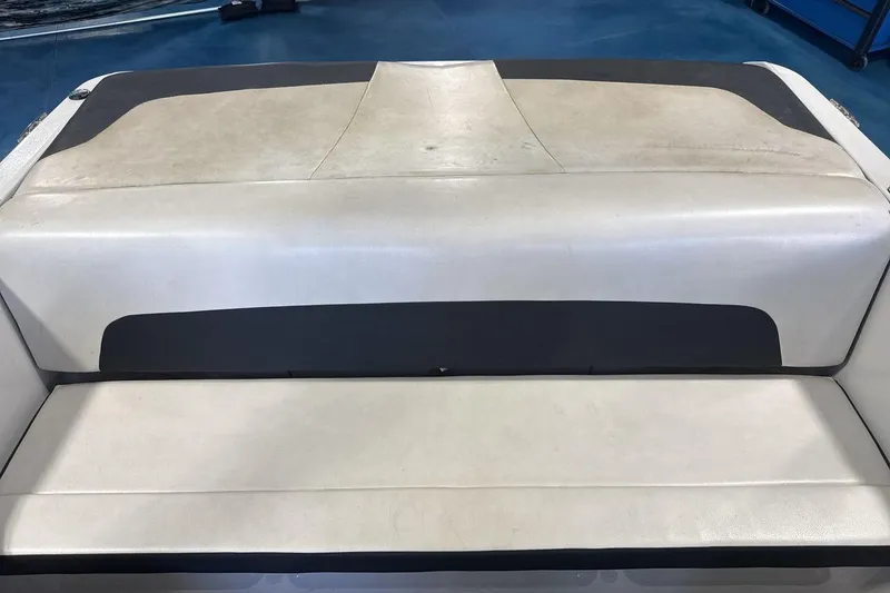 Slide: The Image of 2016 Four Winns 190 Freedom boat seating, featuring beige and black upholstery. - 19
