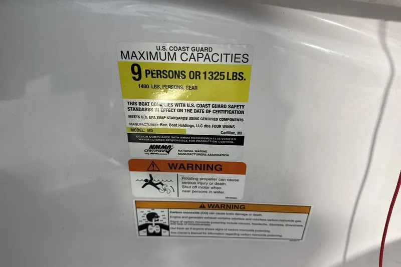 Slide: The Image of U.S. Coast Guard capacity label on 2016 Four Winns 190 Freedom boat. - 21