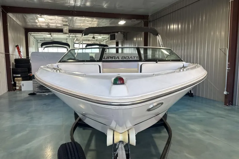Slide: The Image of 2016 Four Winns 190 Freedom boat in storage, front view, indoors. - 8
