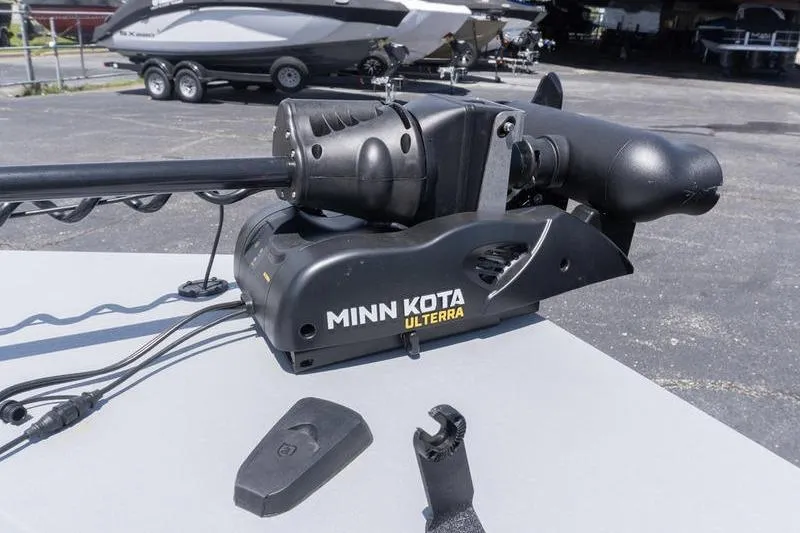 Slide: The Image of Minn Kota Ulterra motor on G3 Sportsman 2400, 2026 model, with accessories on table. - 14