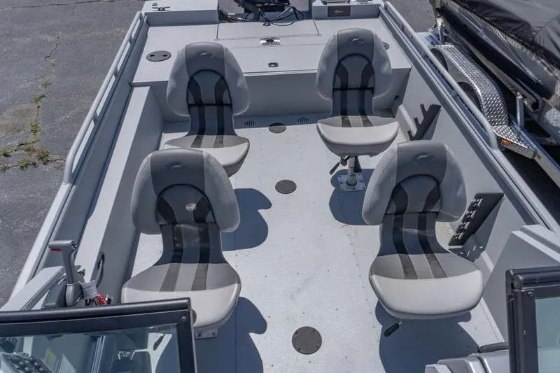 Slide: The Image of 2026 G3 Sportsman 2400 boat interior with four swivel seats. - 15