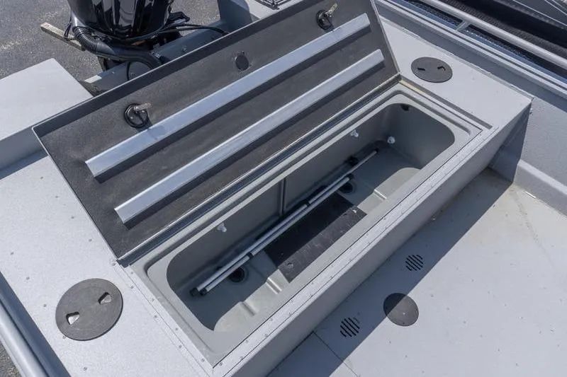 Slide: The Image of Open storage compartment on 2026 G3 Sportsman 2400 boat deck. - 16