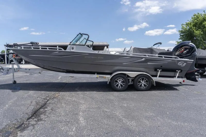 Slide: The Image of 2026 G3 Sportsman 2400 boat on trailer, parked outdoors under a clear sky. - 4
