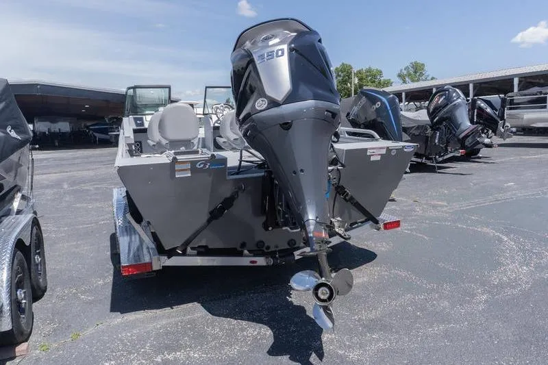 Slide: The Image of 2026 G3 Sportsman 2400 boat with powerful outboard motor, parked on a trailer. - 5