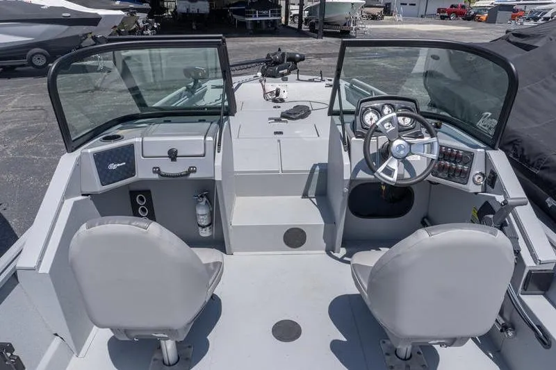 Slide: The Image of 2026 G3 Sportsman 2400 boat interior with dual seats and modern dashboard controls. - 8