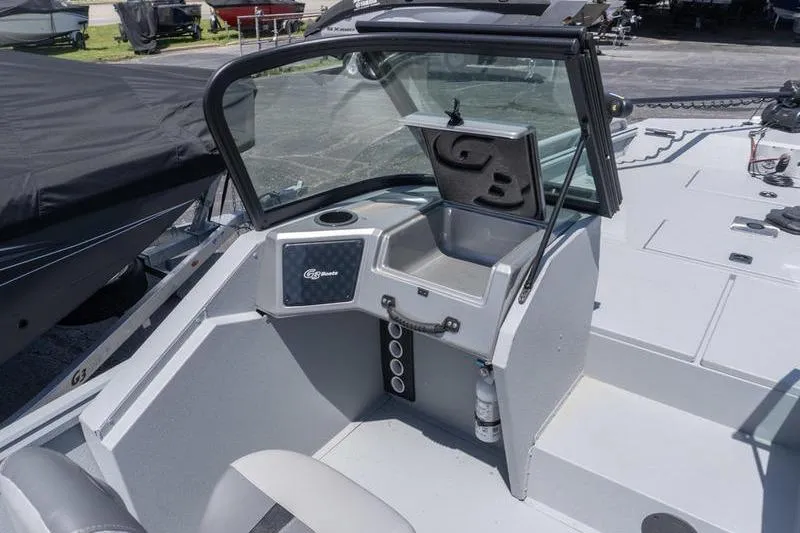 Slide: The Image of 2026 G3 Sportsman 2400 boat interior with windshield and storage compartment. - 9