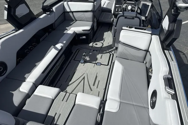 Slide: The Image of 2024 Supra SL 550 boat interior with sleek gray seating and modern design. - 10