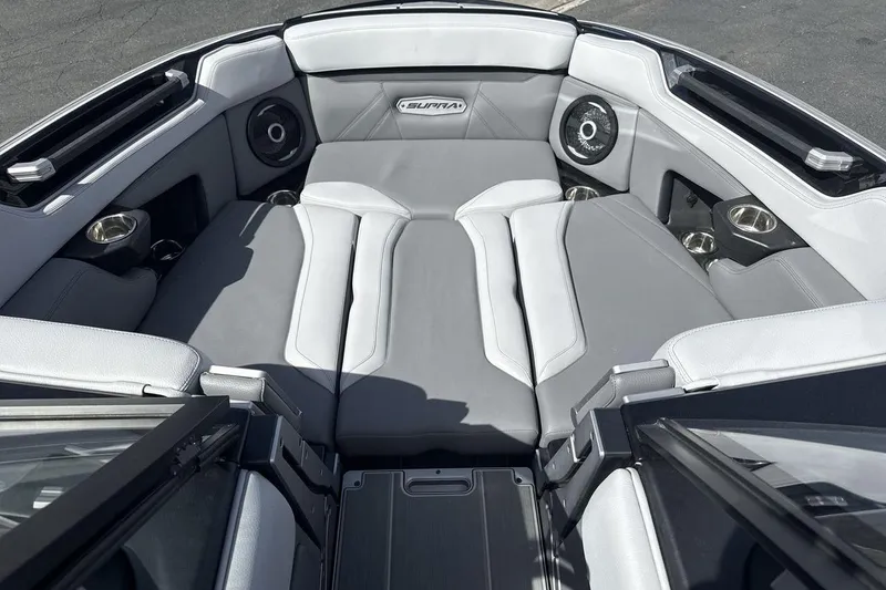 Slide: The Image of 2024 Supra SL 550 boat interior with gray seating and built-in speakers. - 11