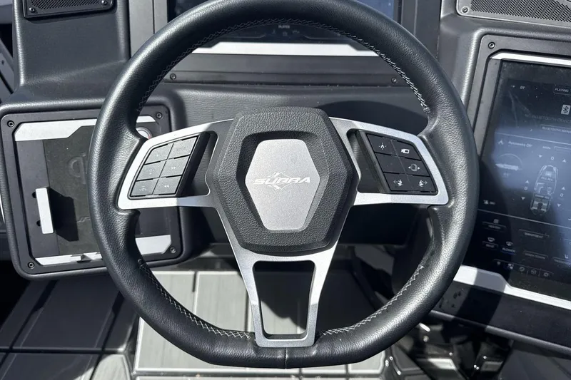 Slide: The Image of 2024 Supra SL 550 steering wheel with integrated controls and modern dashboard display. - 14