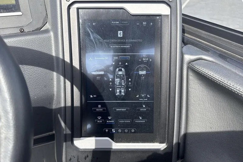 Slide: The Image of 2024 Supra SL 550 dashboard touchscreen displaying control settings and Bluetooth connectivity. - 15