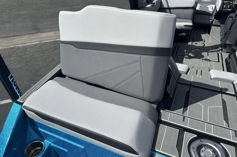 Slide: The Image of 2024 Supra SL 550 boat interior with gray seating and modern design. - 19
