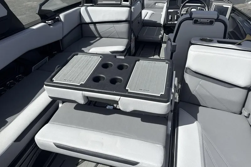 Slide: The Image of 2024 Supra SL 550 interior with luxurious seating and integrated cup holders. - 23