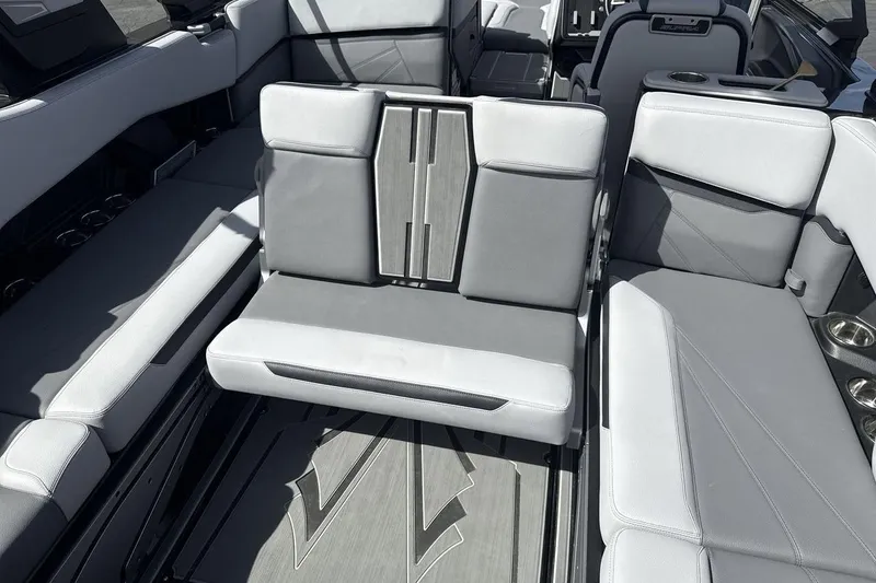 Slide: The Image of 2024 Supra SL 550 boat interior with gray seating and modern design. - 24