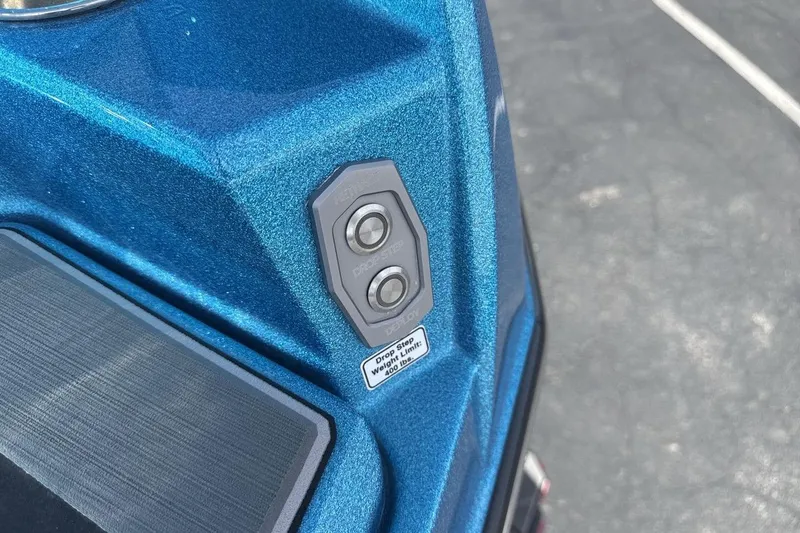 Slide: The Image of Close-up of 2024 Supra SL 550 boat control panel in blue finish. - 27