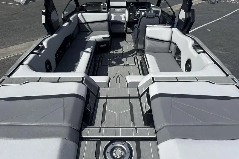 Slide: The Image of 2024 Supra SL 550 boat interior with sleek seating and modern design. - 9