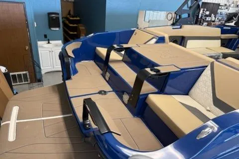 Slide: The Image of 2026 Heyday H22 boat interior with blue and beige seating, showcasing modern design. - 2