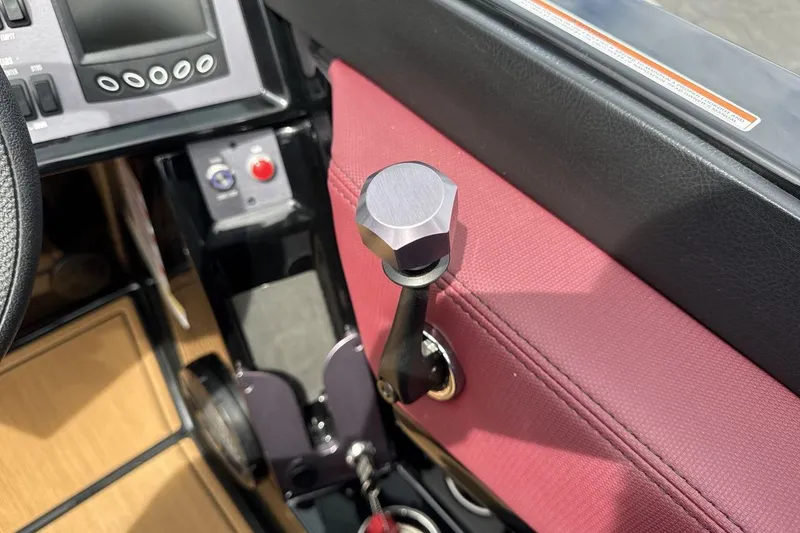 Slide: The Image of Interior of 2023 MasterCraft NXT22 boat showing control panel and throttle lever. - 16