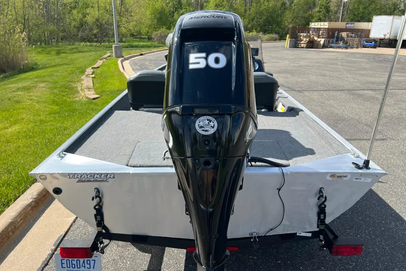 Slide: The Image of 2019 Tracker Bass Tracker Classic XL boat with Mercury 50 engine, parked outdoors. - 6