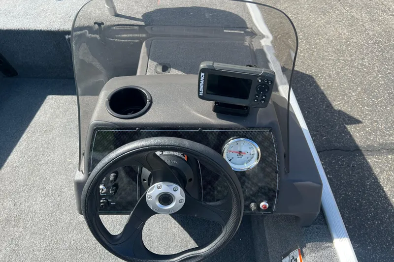 Slide: The Image of 2019 Tracker Bass Tracker Classic XL dashboard with steering wheel and fish finder. - 8