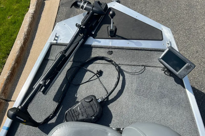 Slide: The Image of 2019 Tracker Bass Tracker Classic XL boat deck with trolling motor and fish finder. - 9