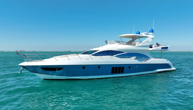 The Image of Luxury 2014 Azimut 70 yacht cruising on clear blue waters. - 0