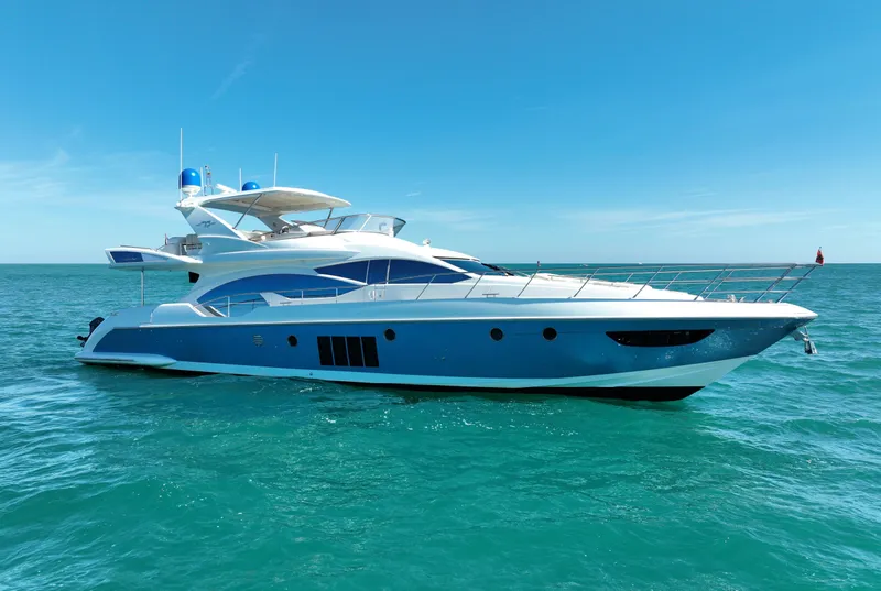Slide: The Image of Luxury 2014 Azimut 70 yacht cruising on clear blue ocean waters. - 2