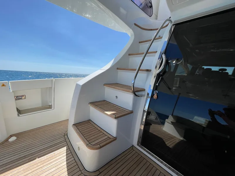 Slide: The Image of Staircase on 2014 Azimut 70 yacht with ocean view and wooden deck. - 36