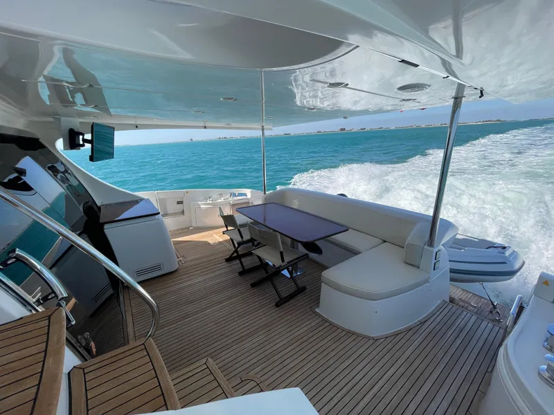 Slide: The Image of Luxurious 2014 Azimut 70 yacht cruising on open sea with elegant deck seating. - 38