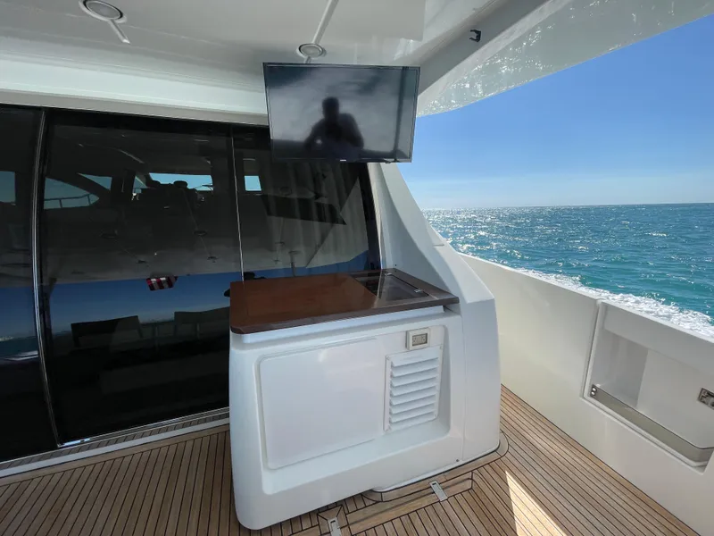 Slide: The Image of Azimut 70 yacht deck with TV, ocean view, and sleek design, 2014 model. - 39