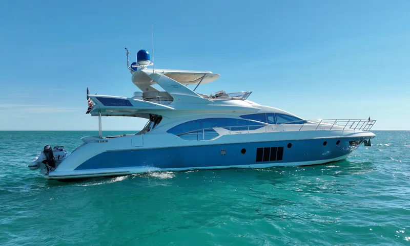 Slide: The Image of 2014 Azimut 70 yacht cruising on clear blue ocean waters. - 4