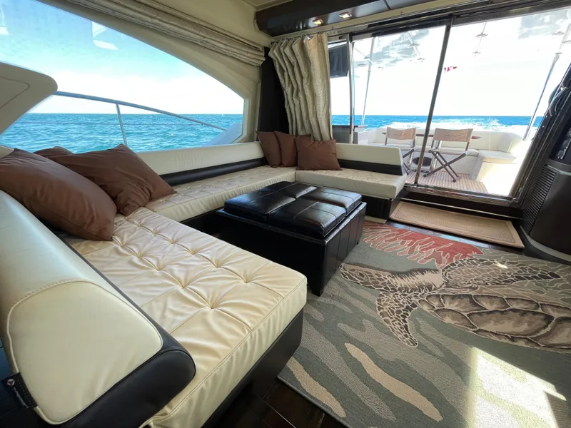 Slide: The Image of Luxurious interior of 2014 Azimut 70 yacht with ocean view and elegant seating area. - 42