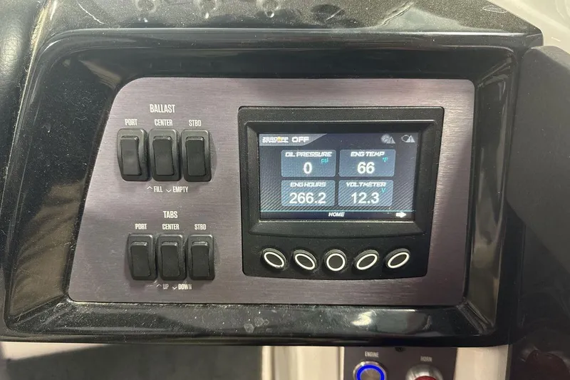 Slide: The Image of 2021 MasterCraft NXT24 dashboard with ballast and engine control display. - 15