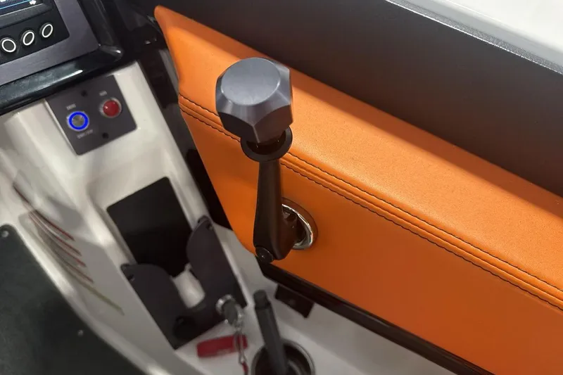 Slide: The Image of Close-up of 2021 MasterCraft NXT24 boat throttle lever and control panel. - 16