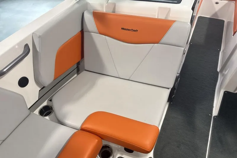 Slide: The Image of 2021 MasterCraft NXT24 boat interior with orange and gray seating. - 17