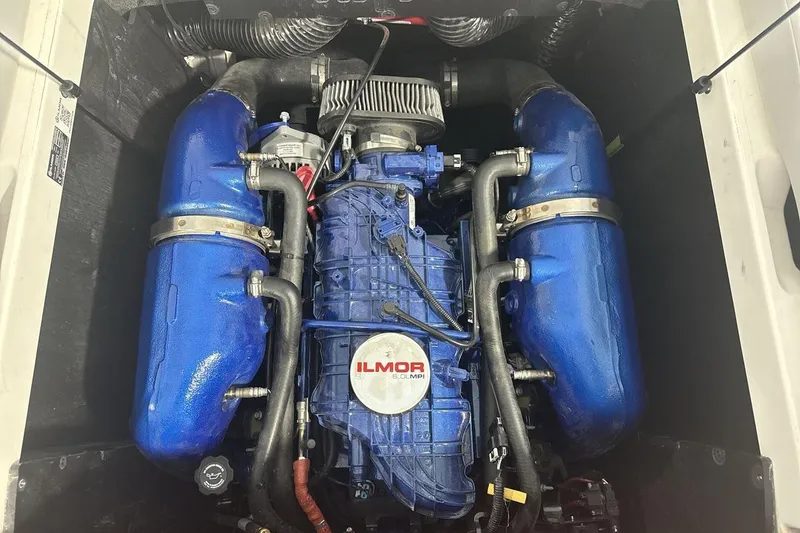 Slide: The Image of 2021 MasterCraft NXT24 engine with blue Ilmor components and visible hoses. - 20