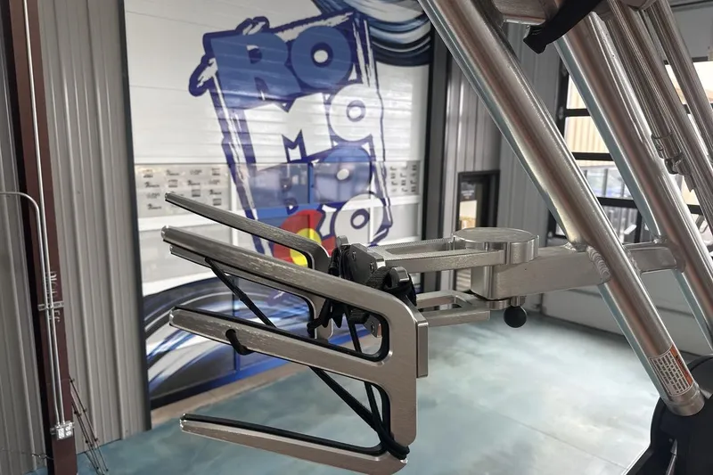 Slide: The Image of 2021 MasterCraft NXT24 boat tower detail in showroom with logo backdrop. - 22