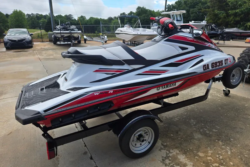 Slide: The Image of 2019 Yamaha WaveRunner VXR jet ski on trailer, parked outdoors. - 2