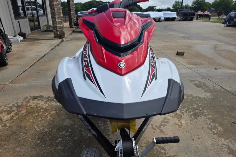 Slide: The Image of 2019 Yamaha WaveRunner VXR in red and white, parked on concrete. - 3