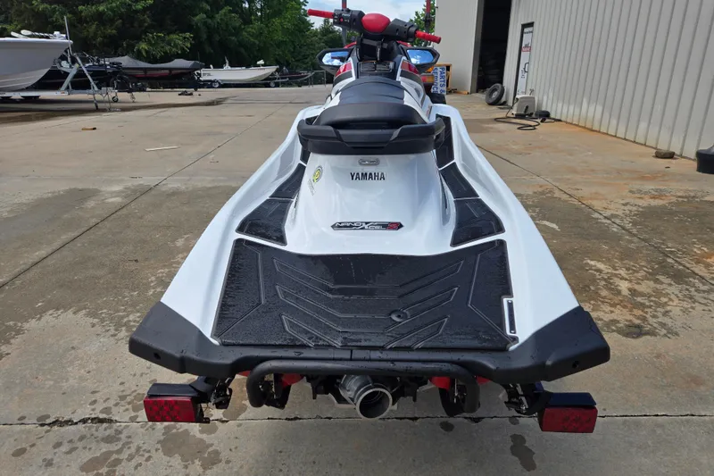 Slide: The Image of 2019 Yamaha WaveRunner VXR jet ski parked on concrete near boats. - 4