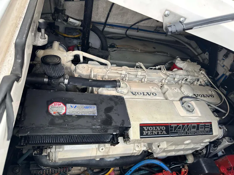 Slide: The Image of 2000 Pursuit 3400 Express engine compartment with Volvo Penta TAMD 63P diesel engine. - 21