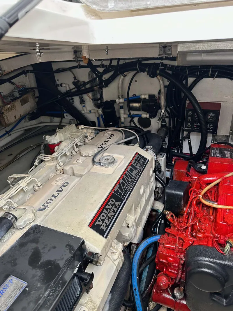 Slide: The Image of Engine compartment of a 2000 Pursuit 3400 Express boat with Volvo Penta engines. - 24