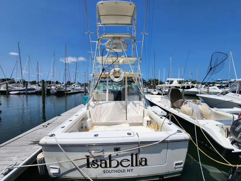 Slide: The Image of 2000 Pursuit 3400 Express boat docked at marina, named Isabella from Southold, NY. - 3