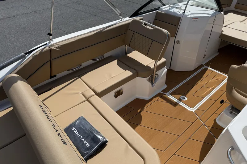 Slide: The Image of 2026 Bayliner D22I boat interior with tan seating and sleek design. - 2