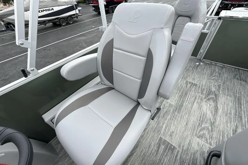 Slide: The Image of 2026 Landau Alure boat seat with gray upholstery and armrests on a textured deck. - 13