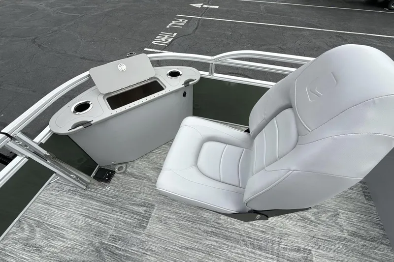 Slide: The Image of 2026 Landau Alure boat interior with white seating and storage compartment. - 18